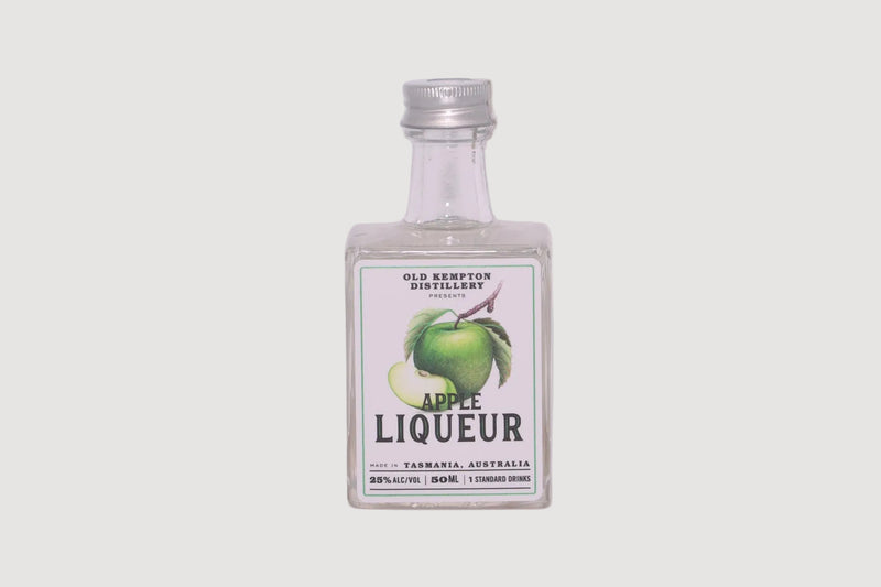 Bottle of Old Kempton Apple Liqueur on a white background