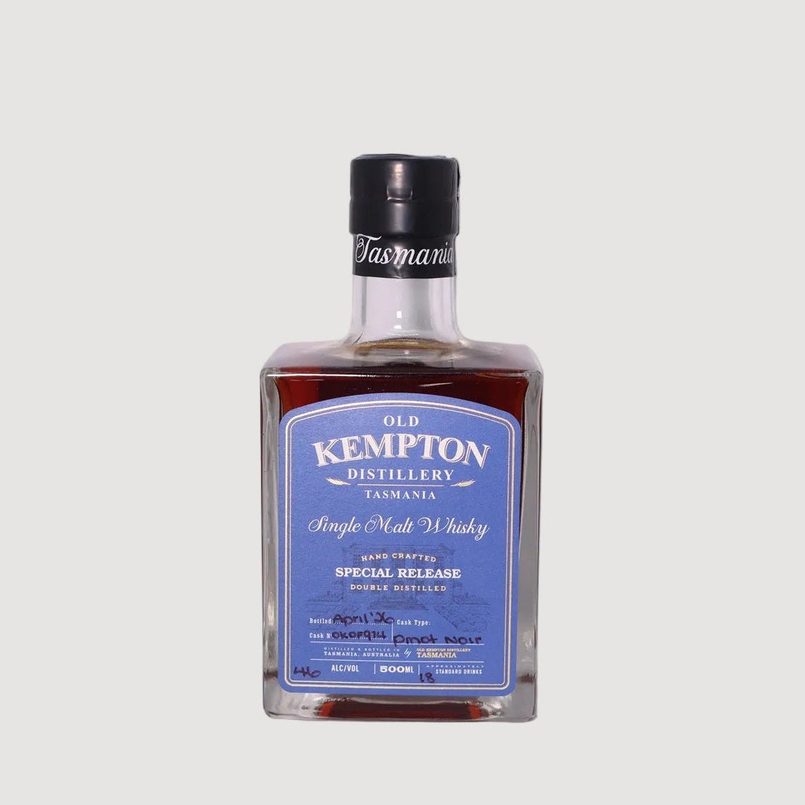 Bottle of Old Kempton whisky on a white background