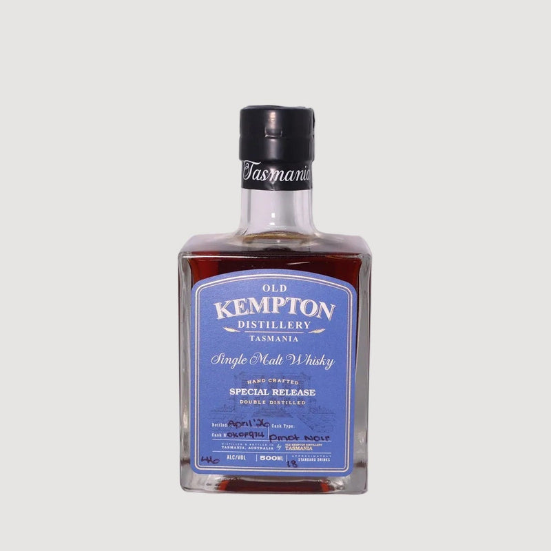 Bottle of Old Kempton whisky on a white background